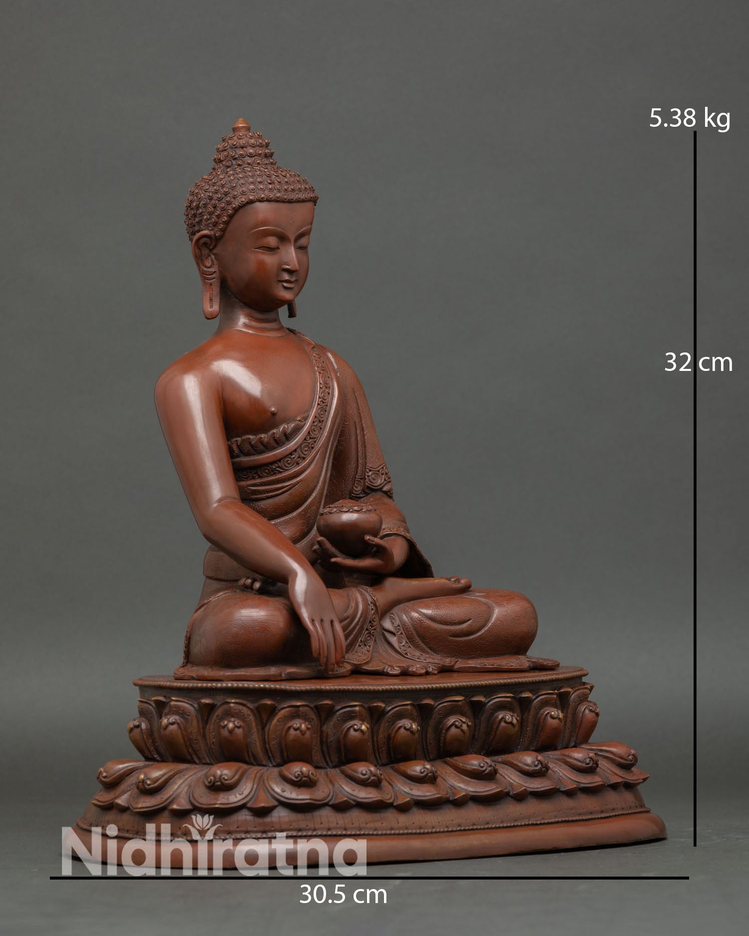 Shakyamuni Buddha side view flowing monastic robes detailed craftsmanship lost wax copper Buddhist sculpture from Patan Nepal.