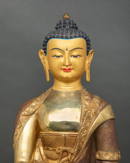 Shakyamuni Buddha statue with 24K gold painted face and serene expression.
