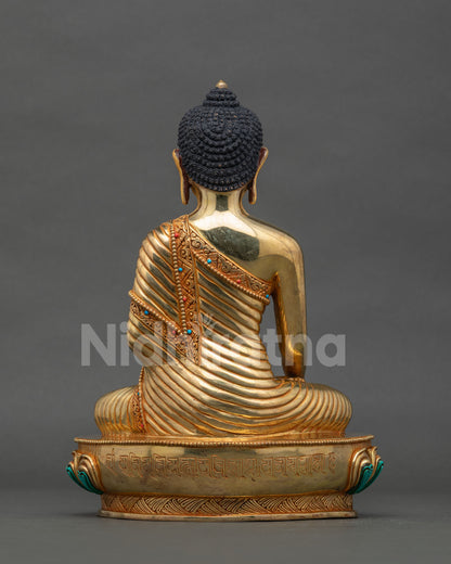 Shakyamuni Buddha statue back view sacred mantra engraved lotus pedestal.