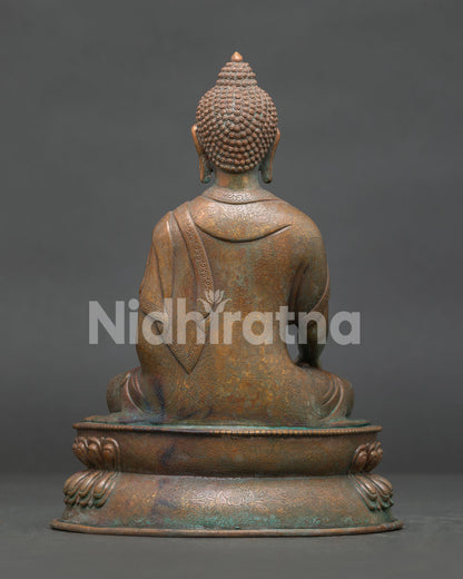 Shakyamuni Buddha statue back view showing traditional Newari copper craftsmanship.