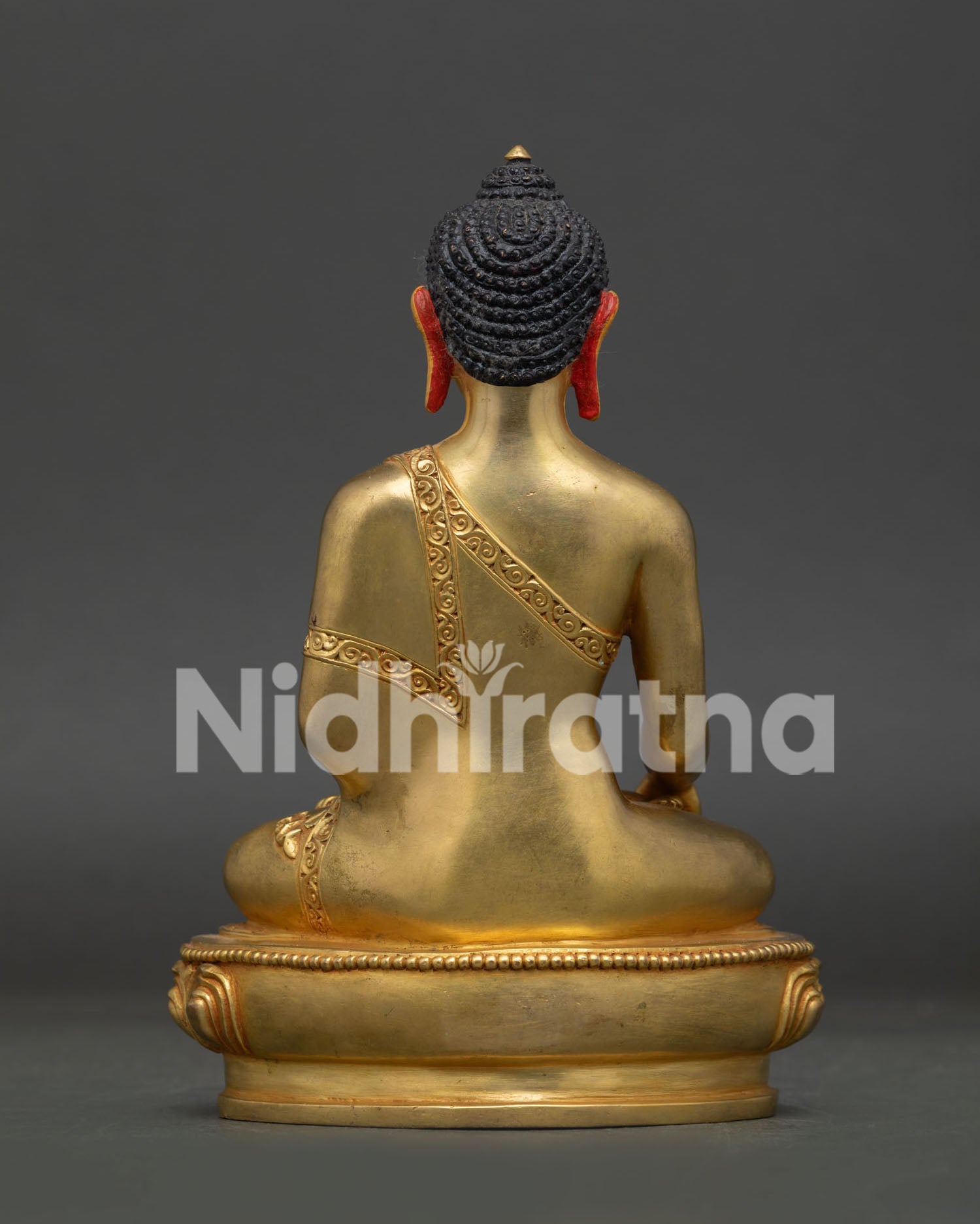 Shakyamuni Buddha statue back view with hand carved monk robe and gold gilded copper finish.
