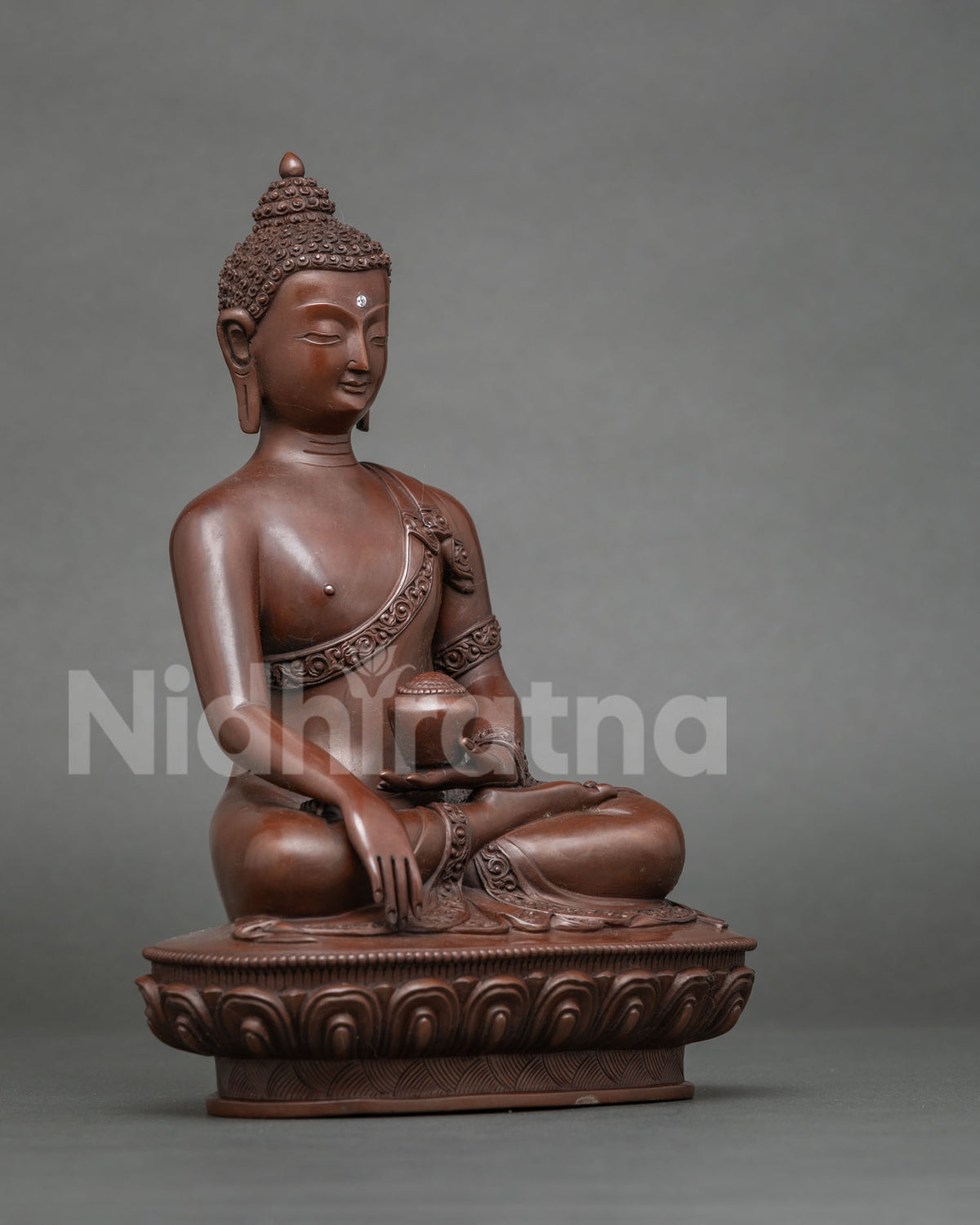 Shakyamuni Buddha statue showing the Bhumisparsha Mudra earth touching gesture.