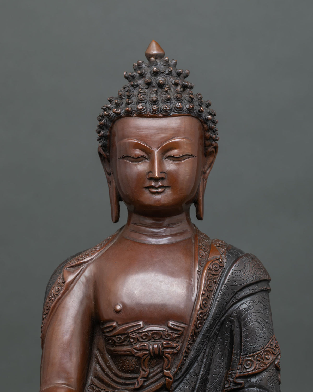 Shakyamuni Buddha statue displaying Bhumisparsha Mudra earth touching hand gesture.