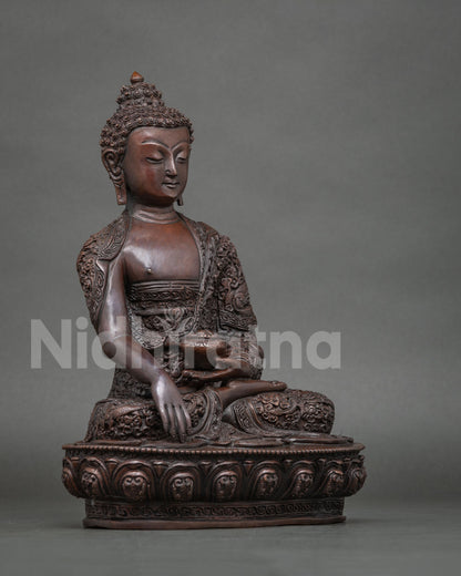 Shakyamuni Buddha statue in the Bhumisparsha Mudra holding a traditional begging bowl symbolizing renunciation and enlightenment.