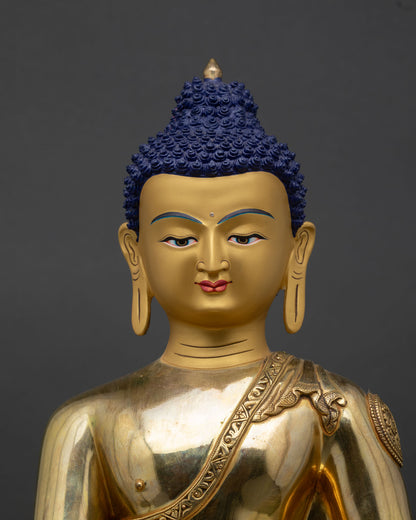 Shakyamuni Buddha statue close-up copper robes lotus seat fire-gilded gold details Nepal