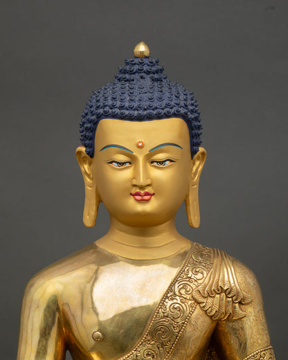 Close up Shakyamuni Buddha statue, handcrafted Nepal copper and gold artwork with intricate lost wax detailing
