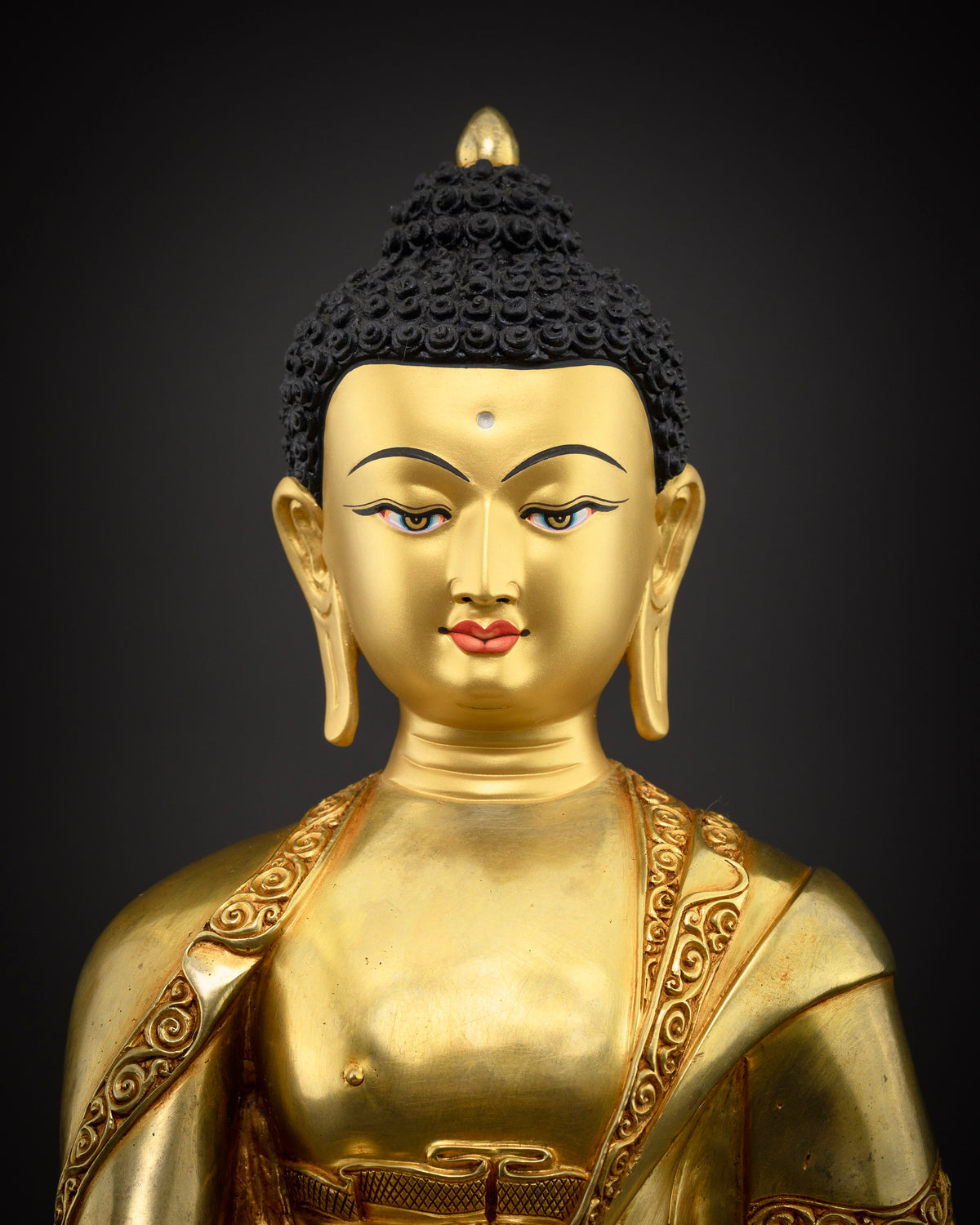 Shakyamuni Buddha statue close-up, hand-chased gold gilded copper detailing