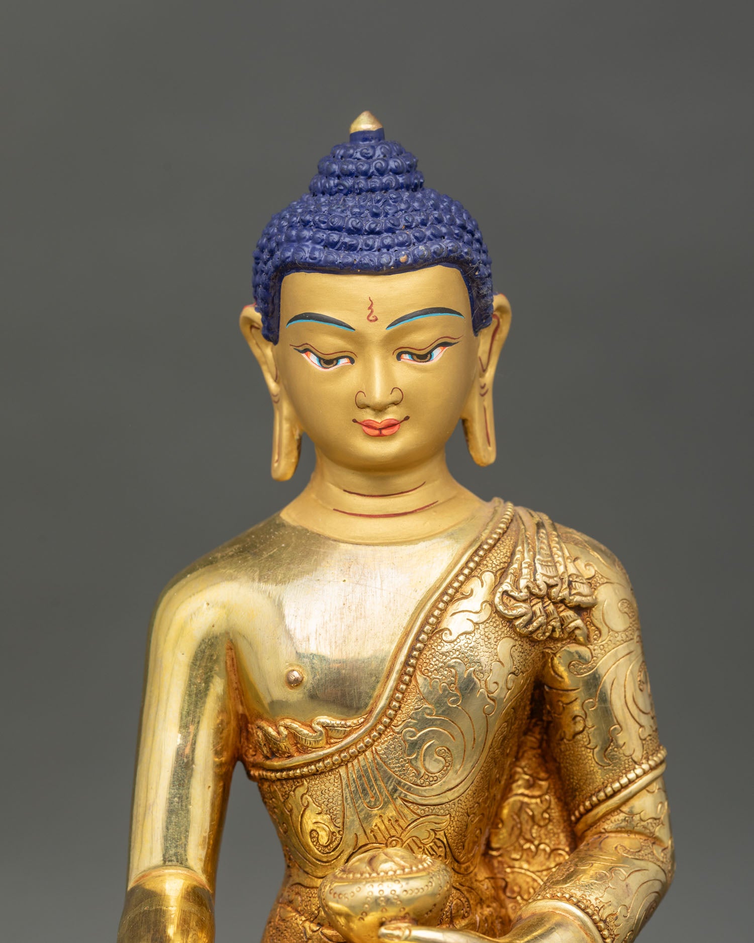 shakyamuni buddha statue close up, handcrafted copper gold fire gilded nepal