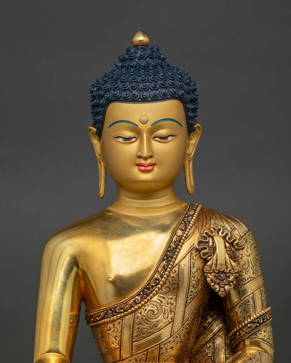Shakyamuni Buddha Statue Close Up Showing Gold Painted Face and Ornate Details