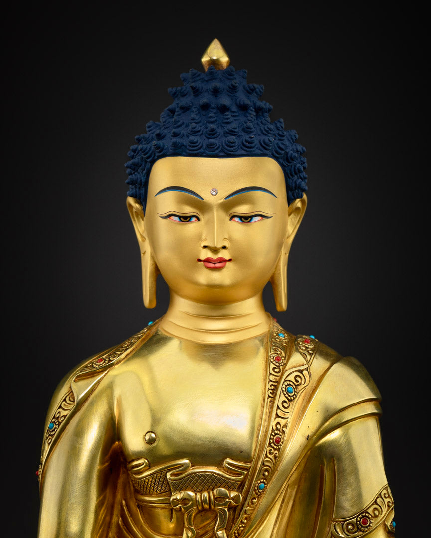 Shakyamuni Buddha statue close-up view - detailed 24K gold gilded copper statue