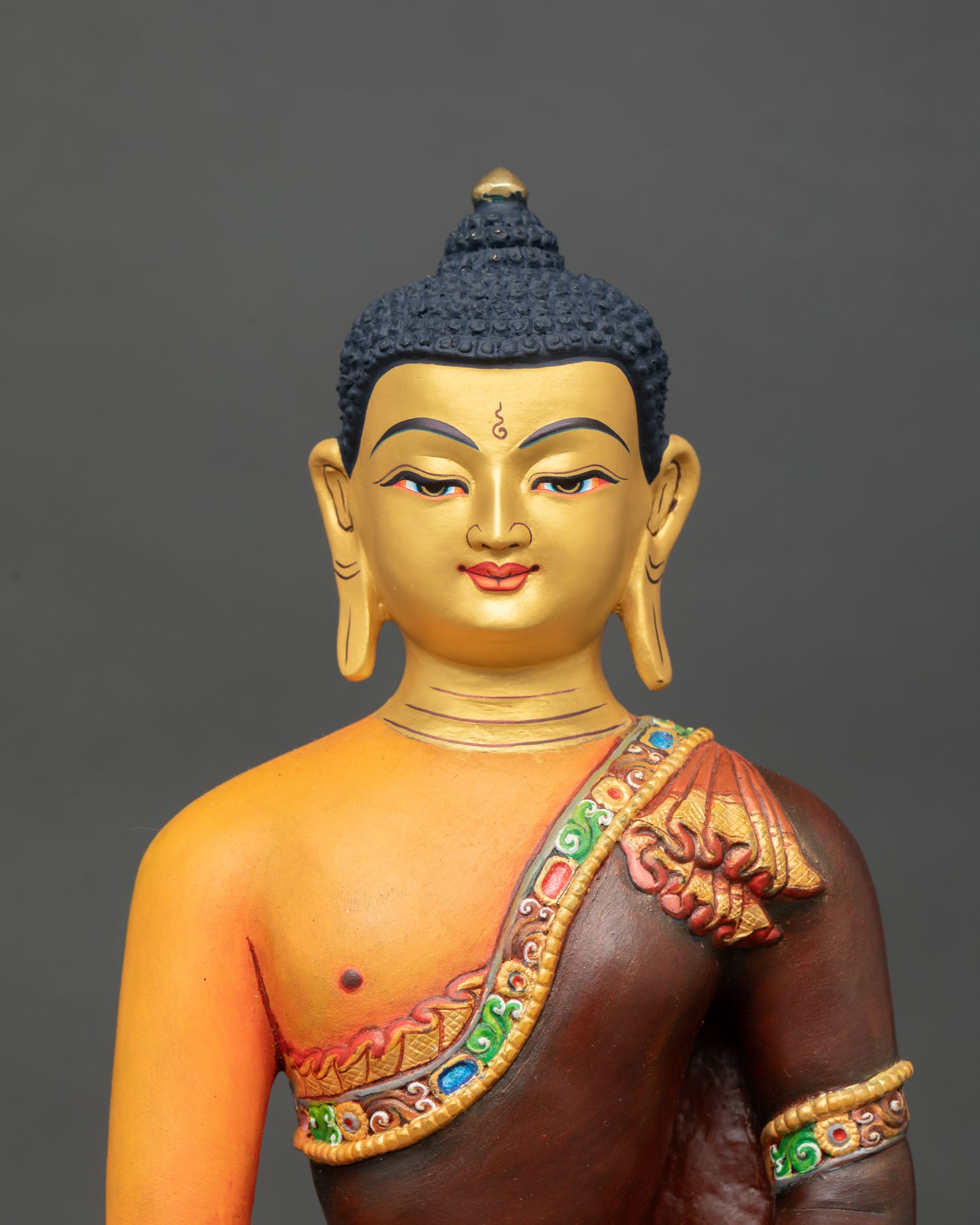 Shakyamuni Buddha statue, close-up view, serene face, gold-gilded robe, detailing handmade Nepal copper Buddhist sculpture