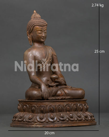 Shakyamuni Buddha statue close up with oxidized copper finish and double lotus pedestal.