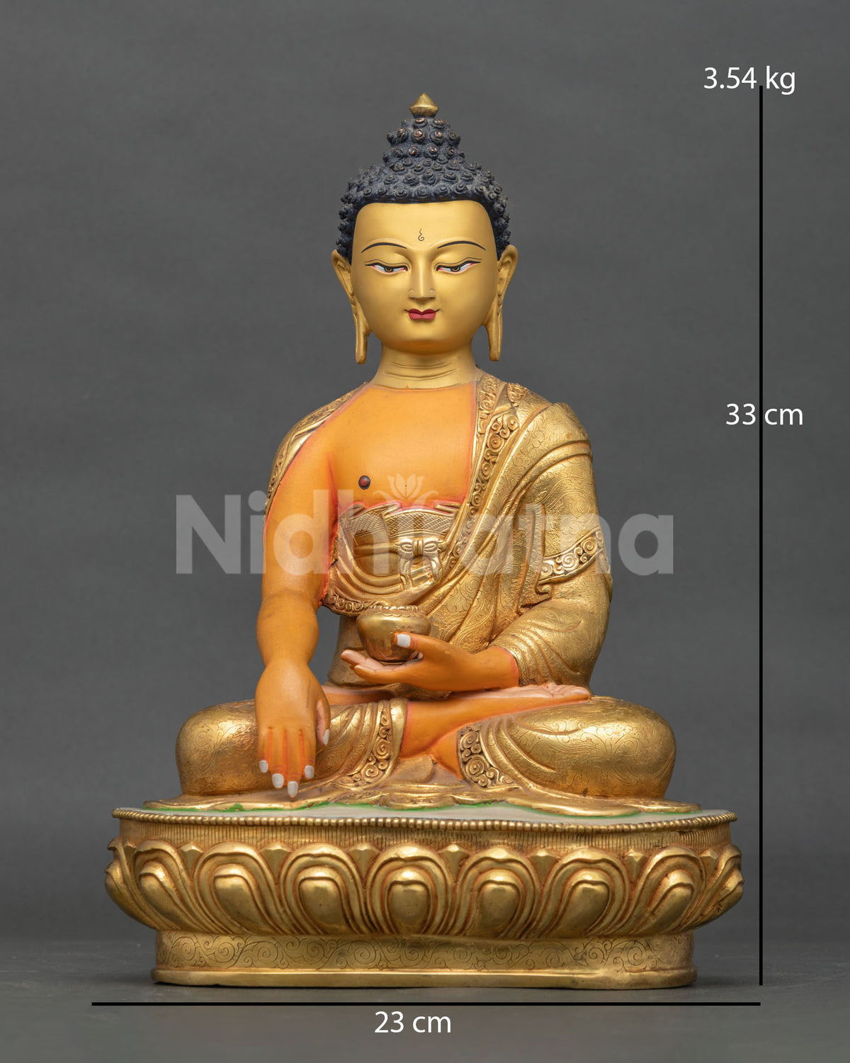 Shakyamuni Buddha statue made from copper with a gold gilded robe and hand carved lotus pedestal handcrafted in Patan Nepal.