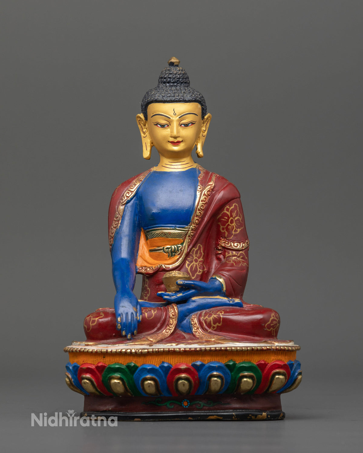 Shakyamuni Buddha statue with Earth Touching Mudra holding sacred patra bowl.