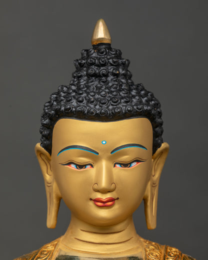Shakyamuni Buddha statue face close up serene expression gold gilded.