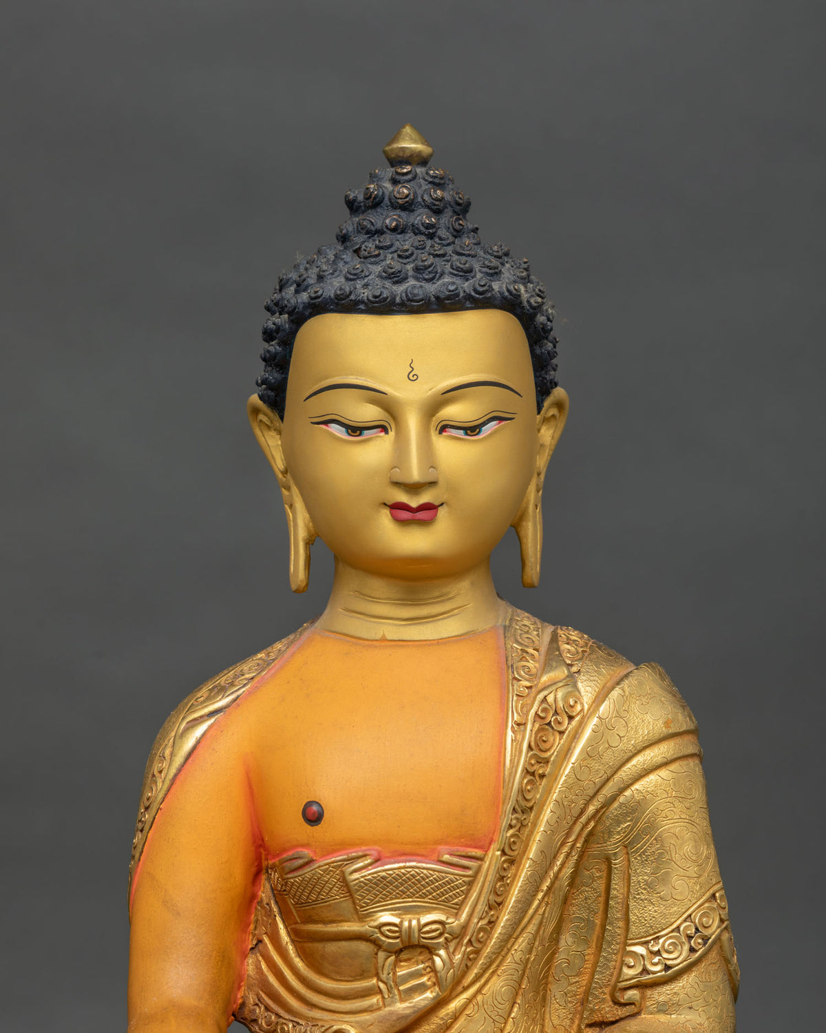 Shakyamuni Buddha statue featuring a finely painted 24K gold face with traditional Himalayan Buddhist craftsmanship.