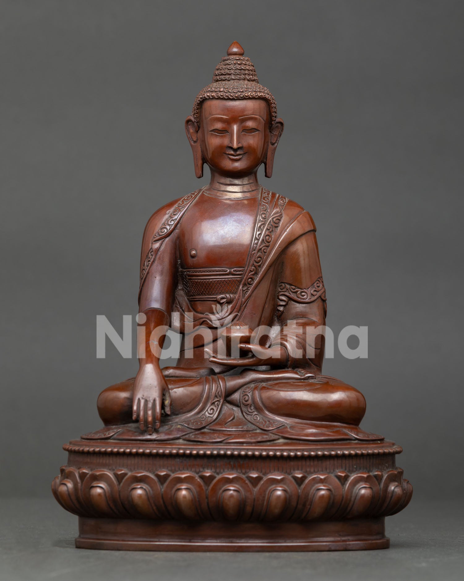 Shakyamuni Buddha statue from Nepal, handcrafted by Newari artisan with oxidized copper finish and lotus throne.