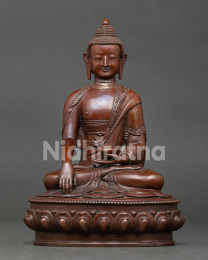 Shakyamuni Buddha statue from Nepal, handcrafted by Newari artisan with oxidized copper finish and lotus throne.