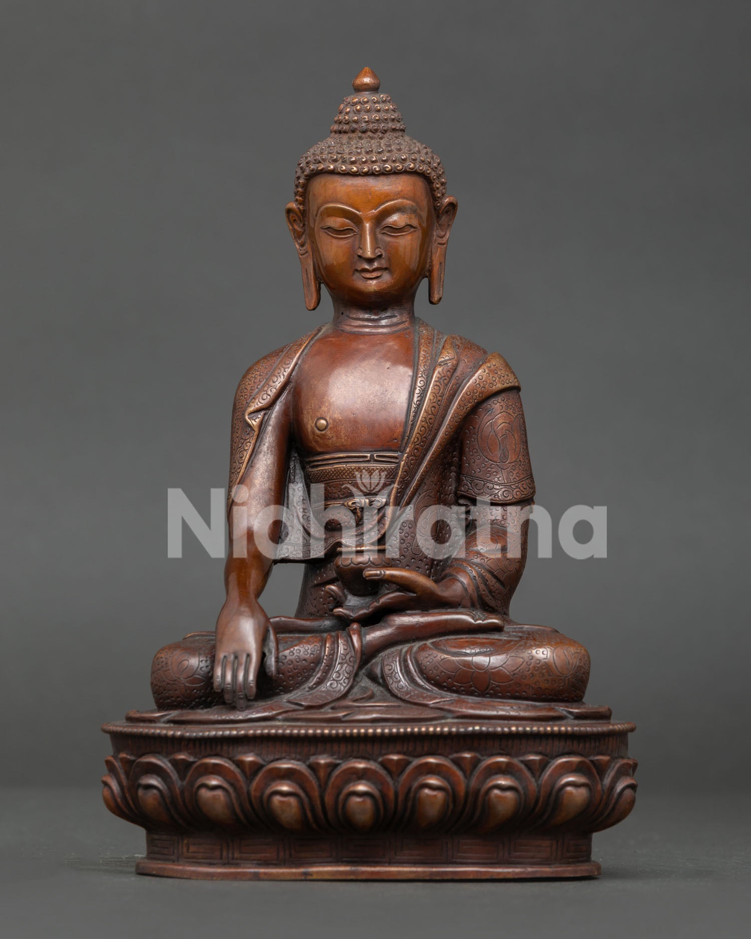 Shakyamuni Buddha statue from Nepal handcrafted by Newar artisan with oxidized copper finish seated on lotus throne