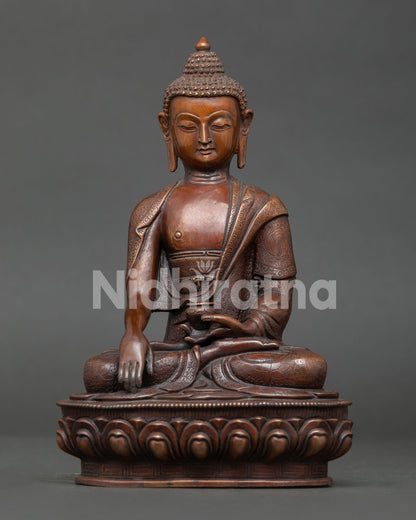 Shakyamuni Buddha statue from Nepal handcrafted by Newar artisan with oxidized copper finish seated on lotus throne