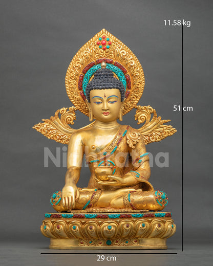 Shakyamuni Buddha statue from Nepal in 24K gold gilded copper, front view with halo and lotus base