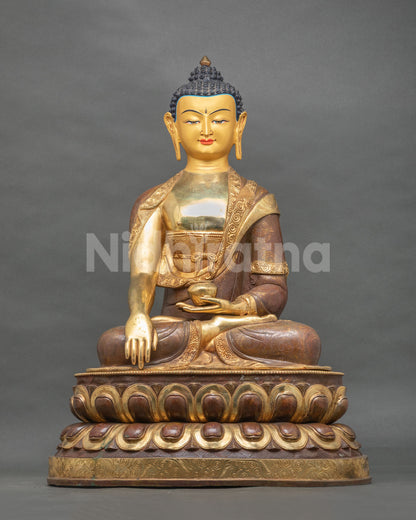 Shakyamuni Buddha statue front view with 24K gold painted face and copper sculpture.