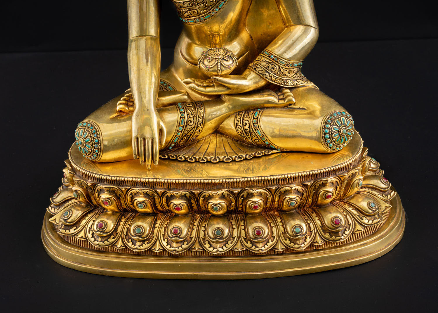Shakyamuni Buddha statue front view showing ornate double-lotus pedestal with jeweled petals