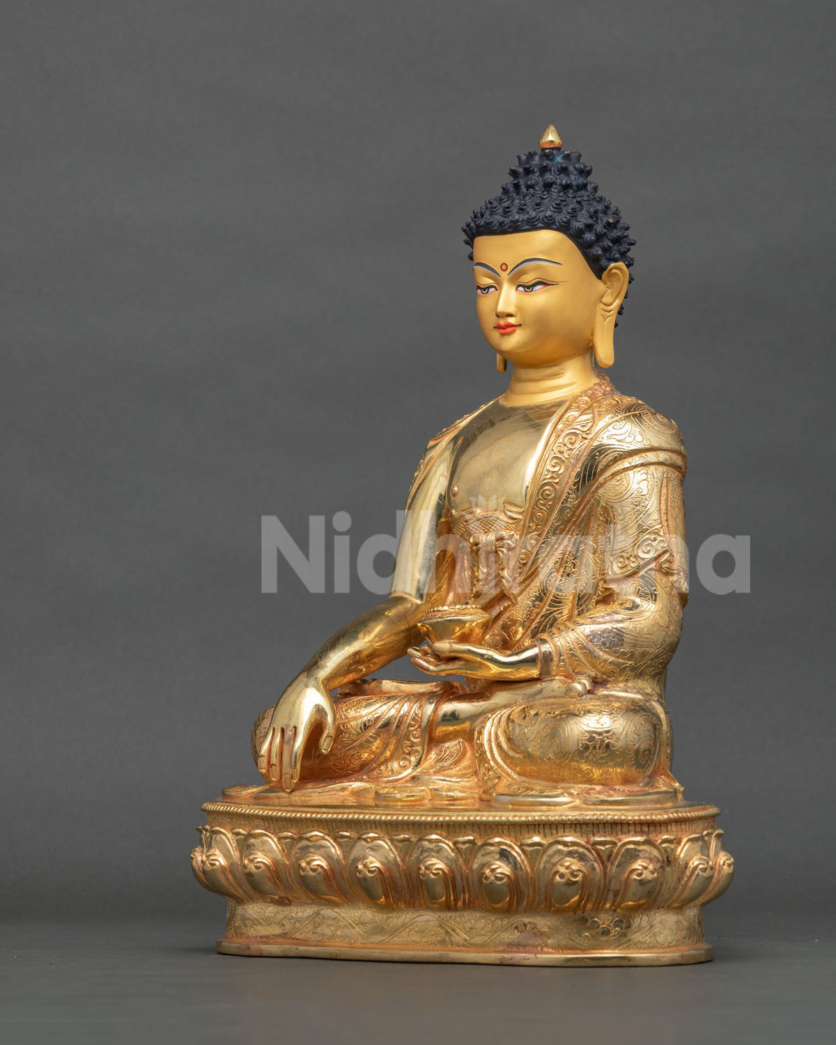 Shakyamuni Buddha statue gold fire gilded copper left side view.