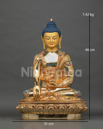 Shakyamuni Buddha statue gold fire gilded copper patan nepal front view.