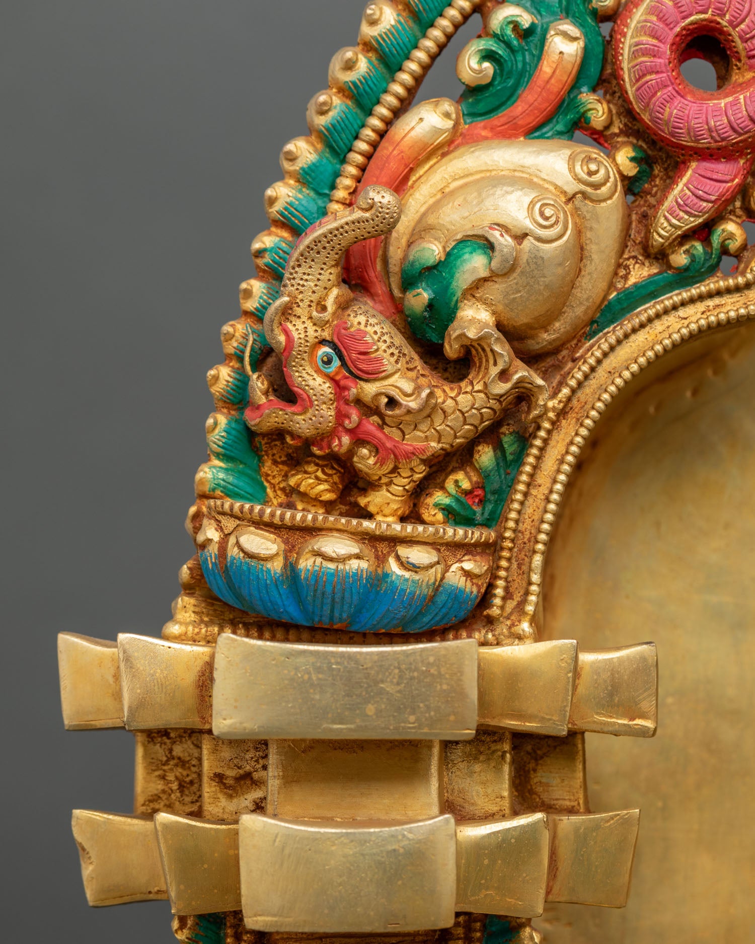 Shakyamuni Buddha statue halo close-up with gold gilded radiant detailing