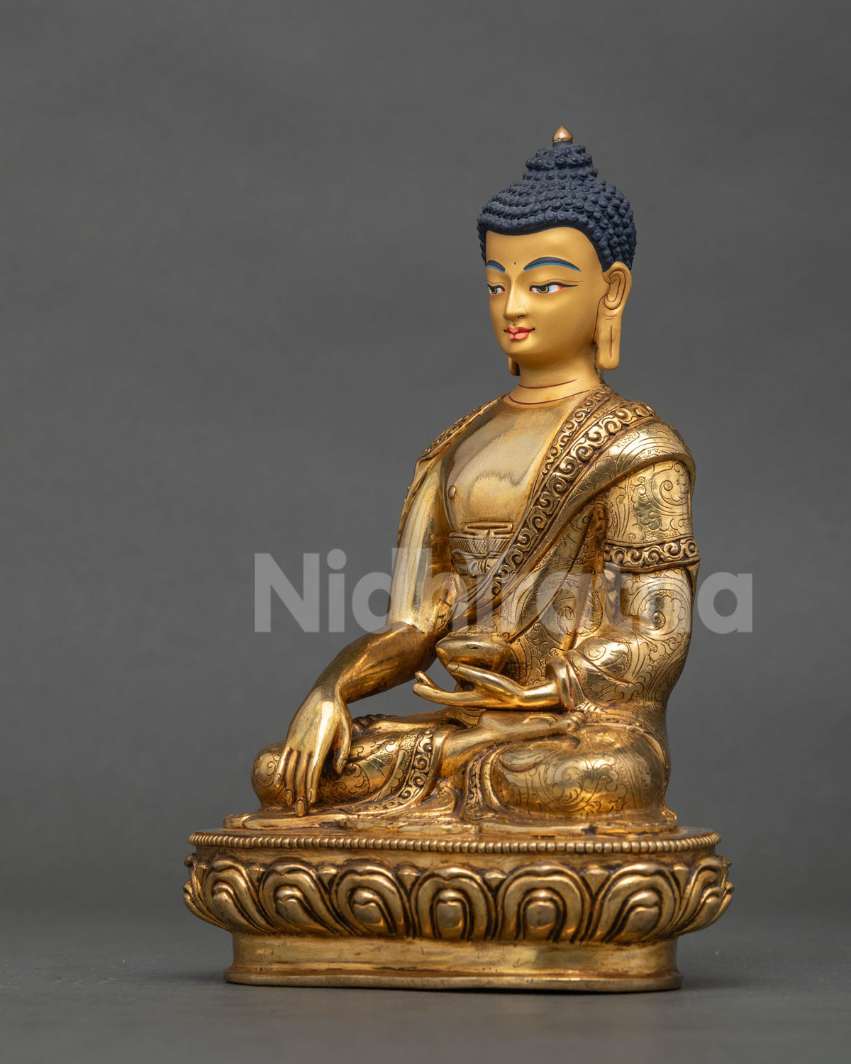 Shakyamuni Buddha statue hand carved lotus pedestal floral motifs Nepal.