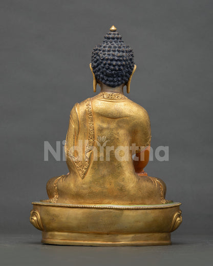 Shakyamuni Buddha statue seated on a hand carved lotus pedestal crafted by a skilled Newari artist from Nepal.