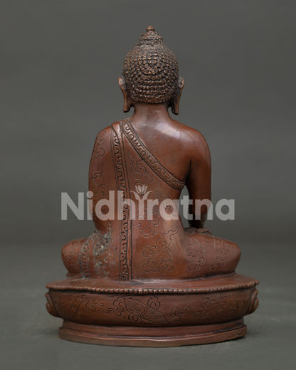 Shakyamuni Buddha Statue handcrafted by Newari artisans from Patan Nepal with copper oxidized finish.