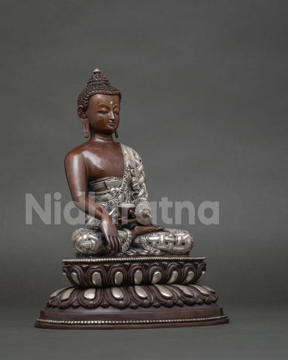 Shakyamuni buddha statue handcrafted by newari artist in patan nepal with silver plated details.