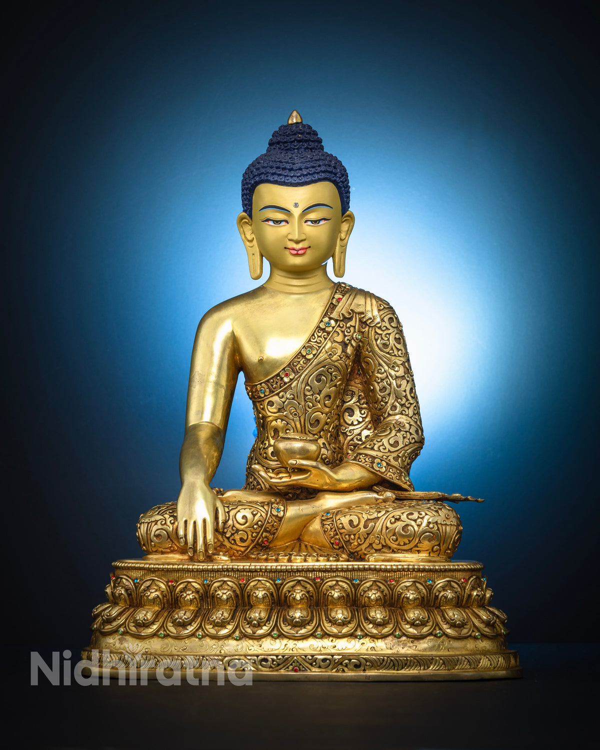 Shakyamuni Buddha statue handcrafted from solid copper with gold fire gilding by Newari artisans in Patan Nepal.