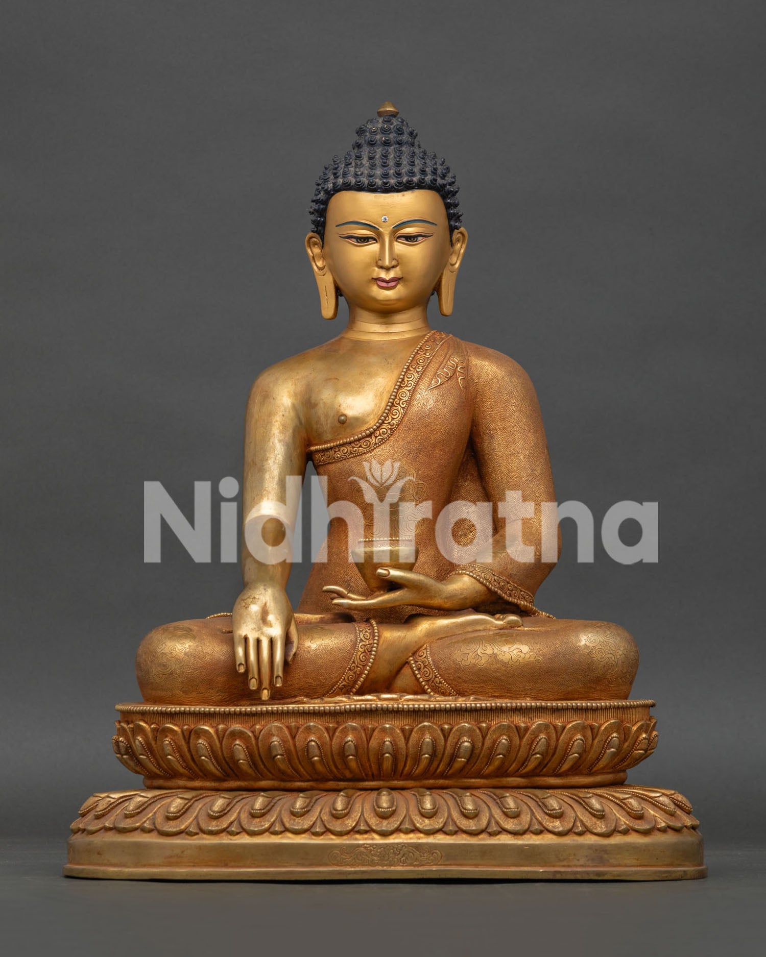 Shakyamuni Buddha statue handcrafted in Nepal with 24K gold gilding and copper lotus throne