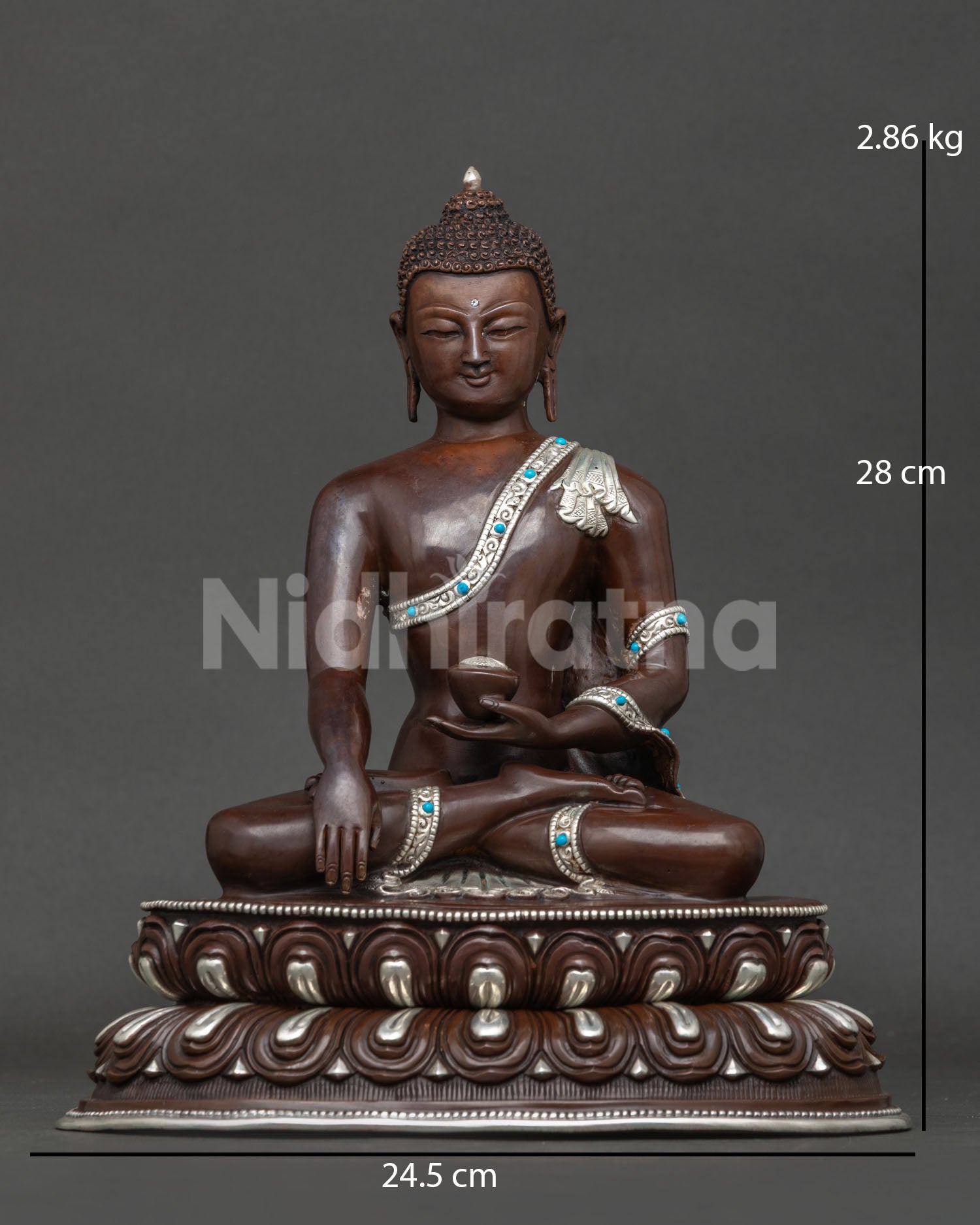 Shakyamuni buddha statue handcrafted in patan nepal with oxidized copper and silver plated details.