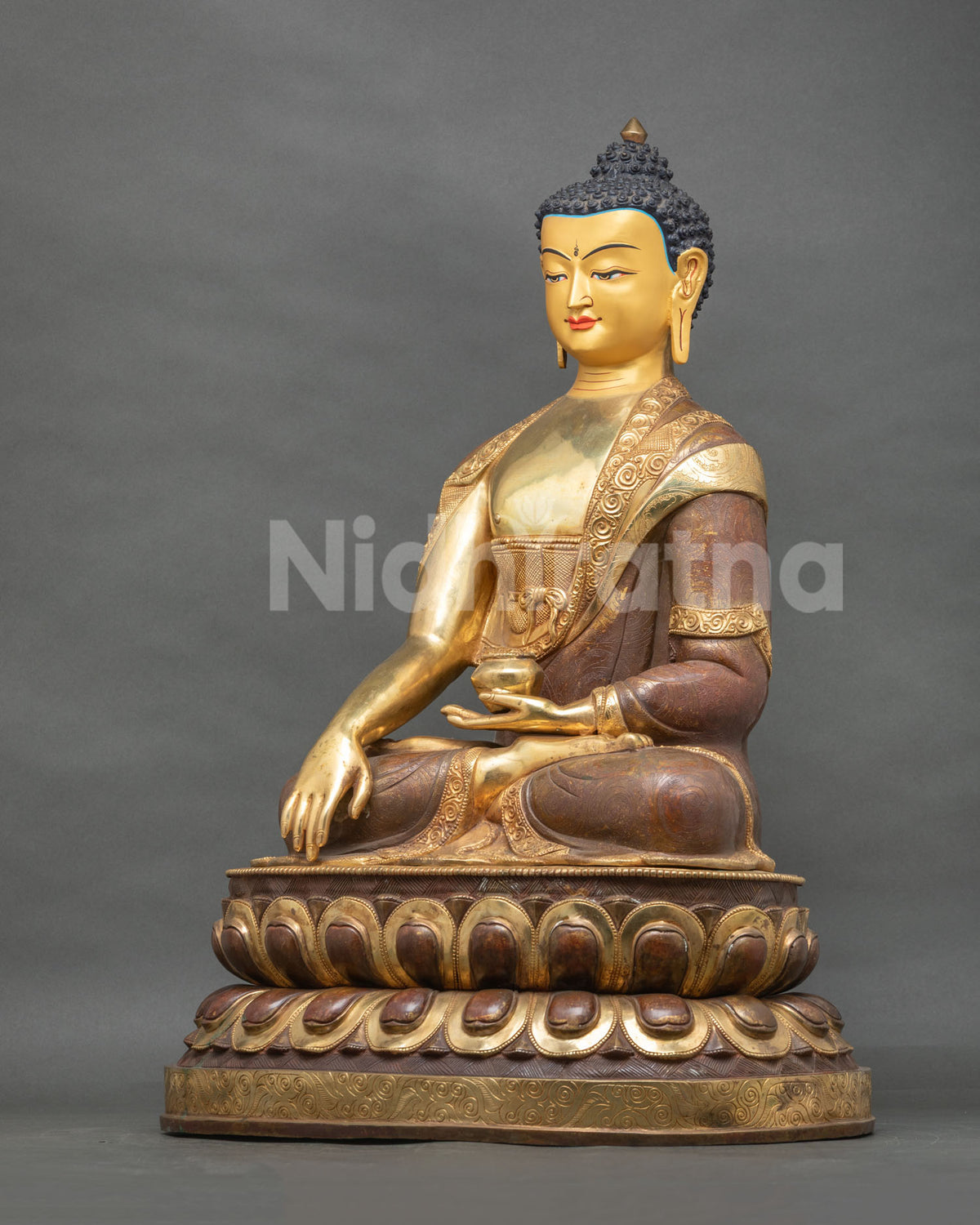 Shakyamuni Buddha statue holding a begging bowl the monastic path.