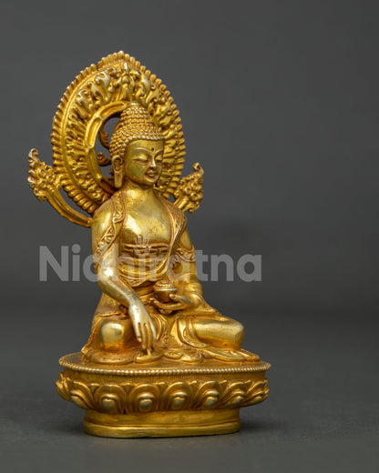 Shakyamuni Buddha statue in copper with gold fire gilded finish and begging bowl.