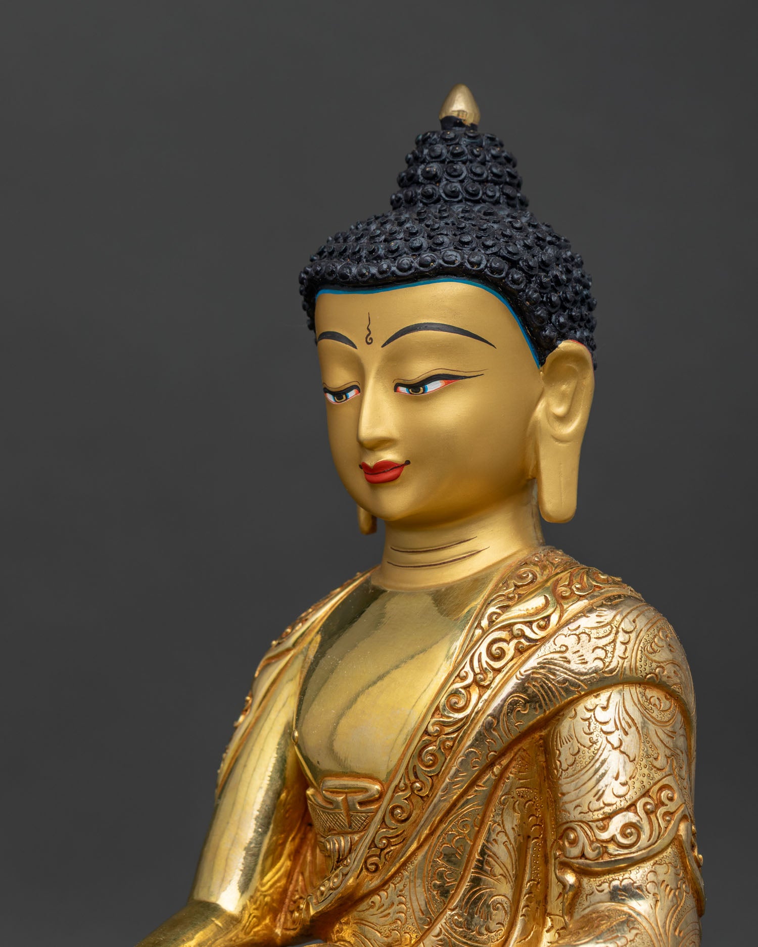 Shakyamuni Buddha statue intricate robe details side close up