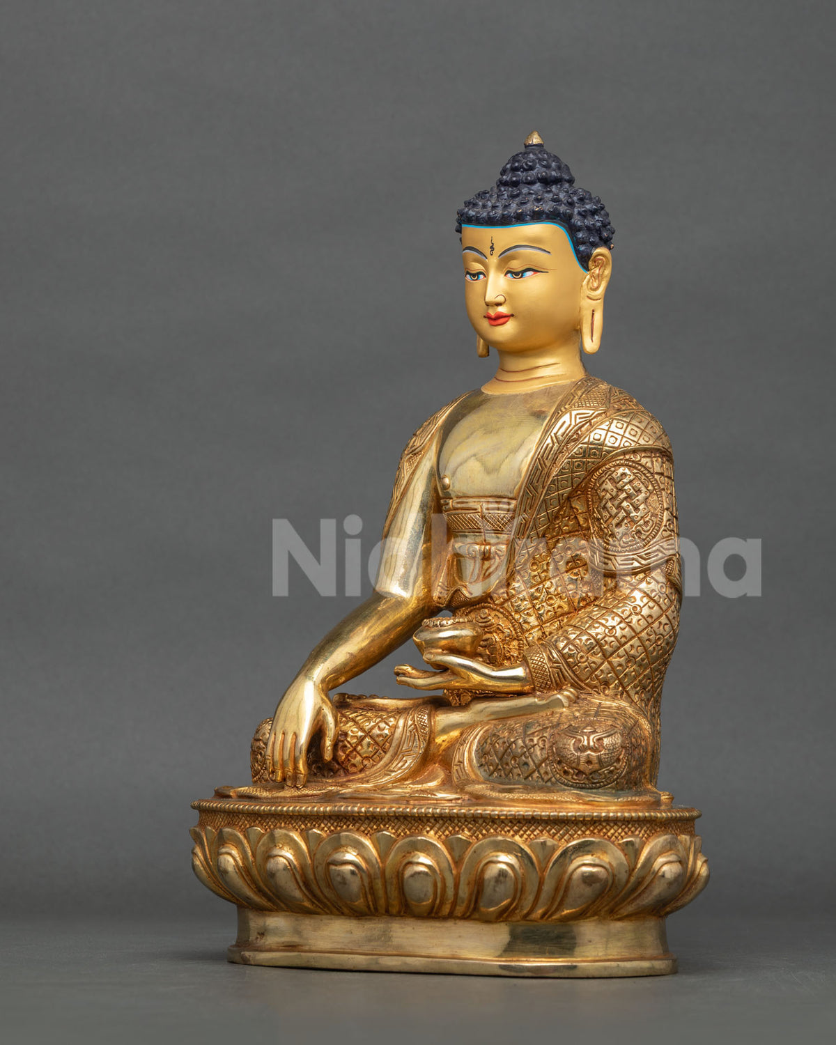 Shakyamuni Buddha statue left side view gold gilded copper.