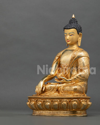 Shakyamuni Buddha statue left side view monk robe begging bowl.