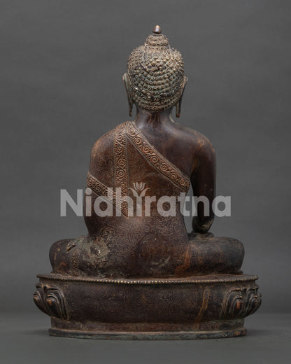 Shakyamuni Buddha statue lotus backrest with vajra Dharma Chakra and deer motifs.