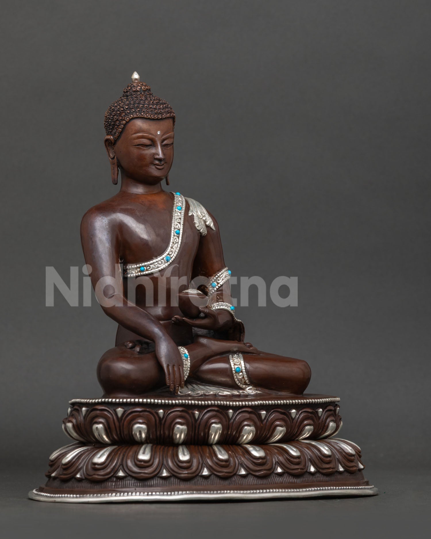Shakyamuni buddha statue right view showing bhumisparsa mudra and turquoise patra bowl.