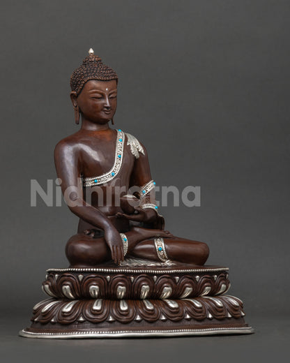 Shakyamuni buddha statue right view showing bhumisparsa mudra and turquoise patra bowl.