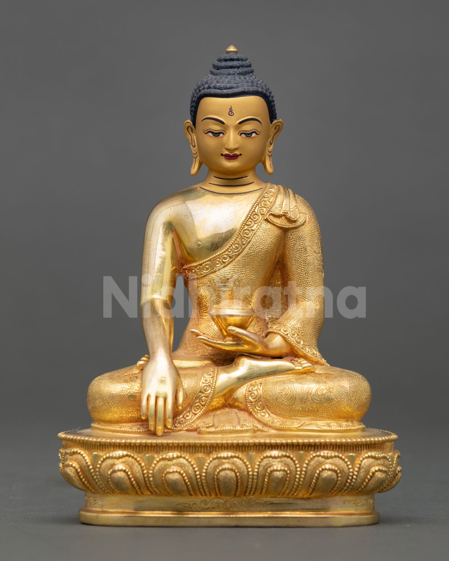 Shakyamuni Buddha statue, seated in earth touching mudra holding a begging bowl symbolizing enlightenment