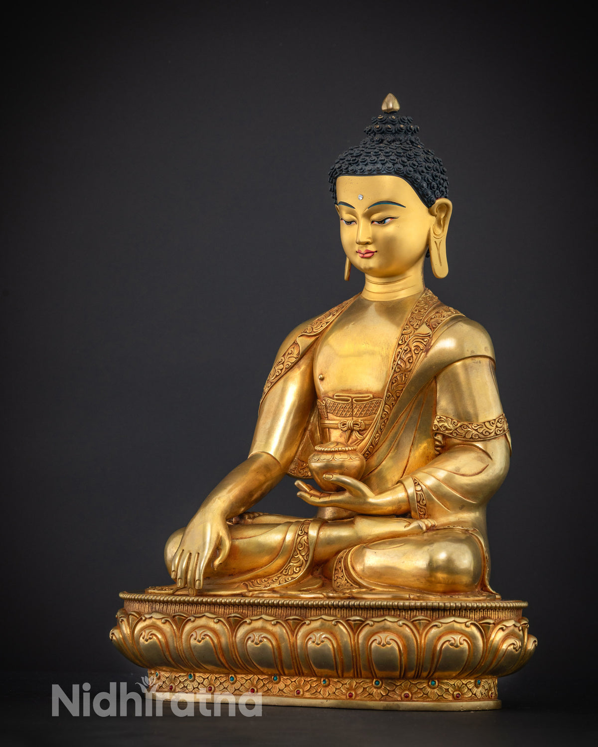 Shakyamuni Buddha statue seated in vajra posture, left side