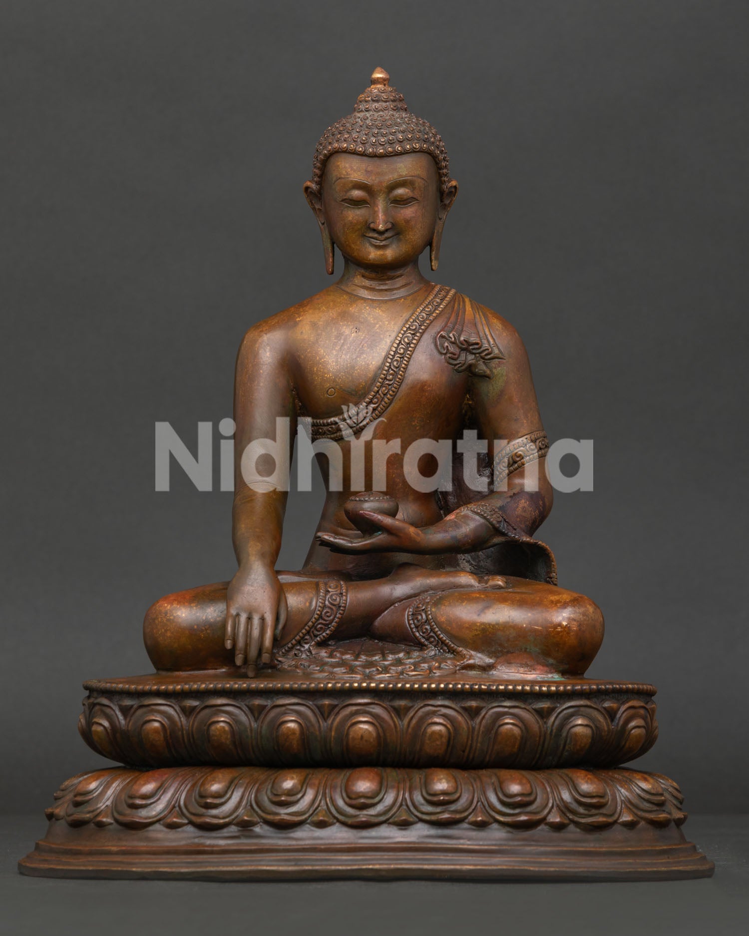 Shakyamuni Buddha statue seated on double lotus pedestal, oxidized copper finish handcrafted by Newari artisans Nepal.