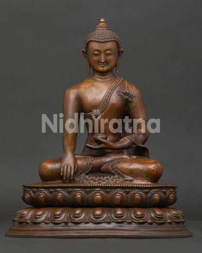 Shakyamuni Buddha statue seated on double lotus pedestal, oxidized copper finish handcrafted by Newari artisans Nepal.
