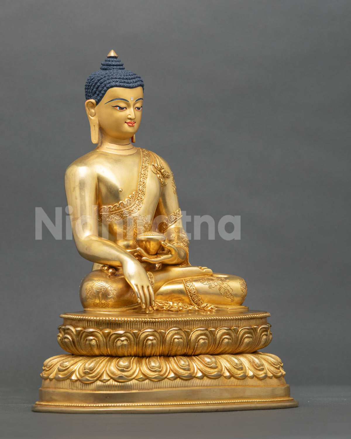 Shakyamuni Buddha statue seated on handcarved double lotus pedestal right side view.